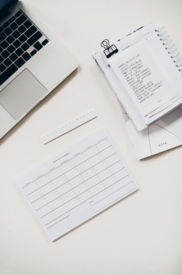 Desk with financial charts and a calculator
